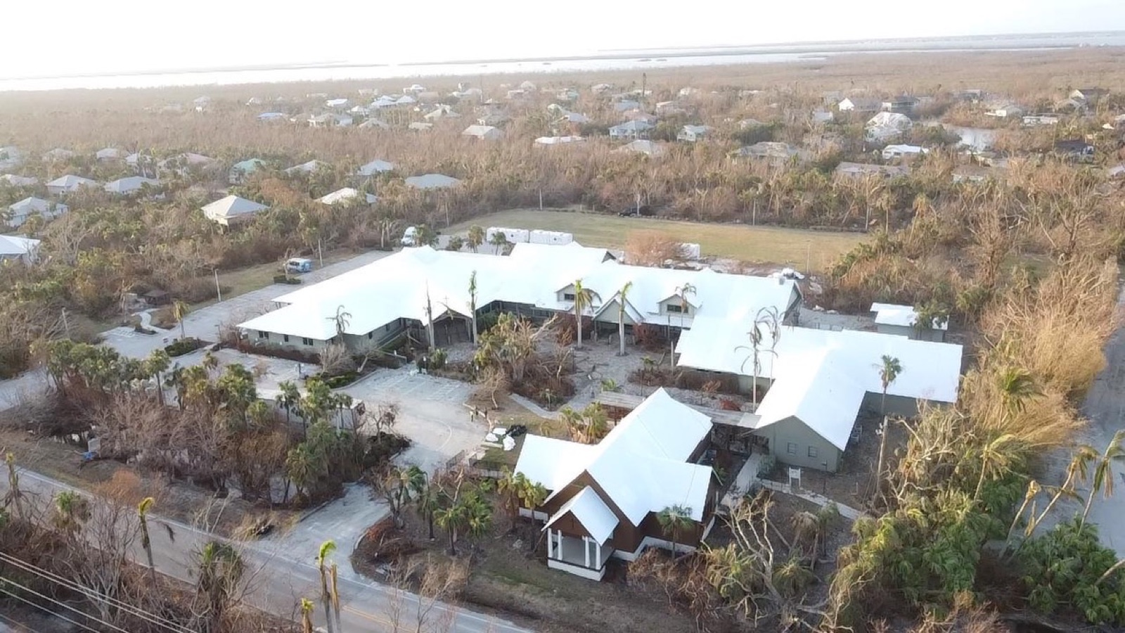 Disaster recovery roof protection across an institutional campus after a hurricane