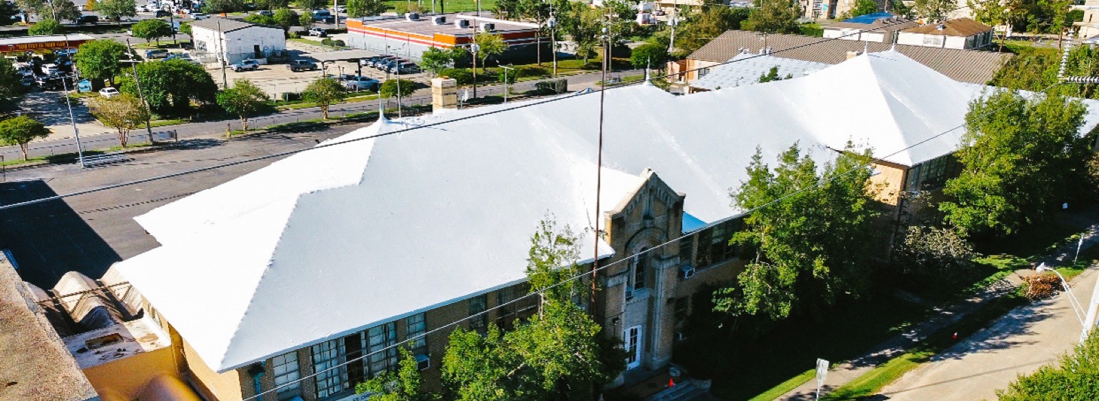 St. Christopher school sealed under a white Elastowrap roof